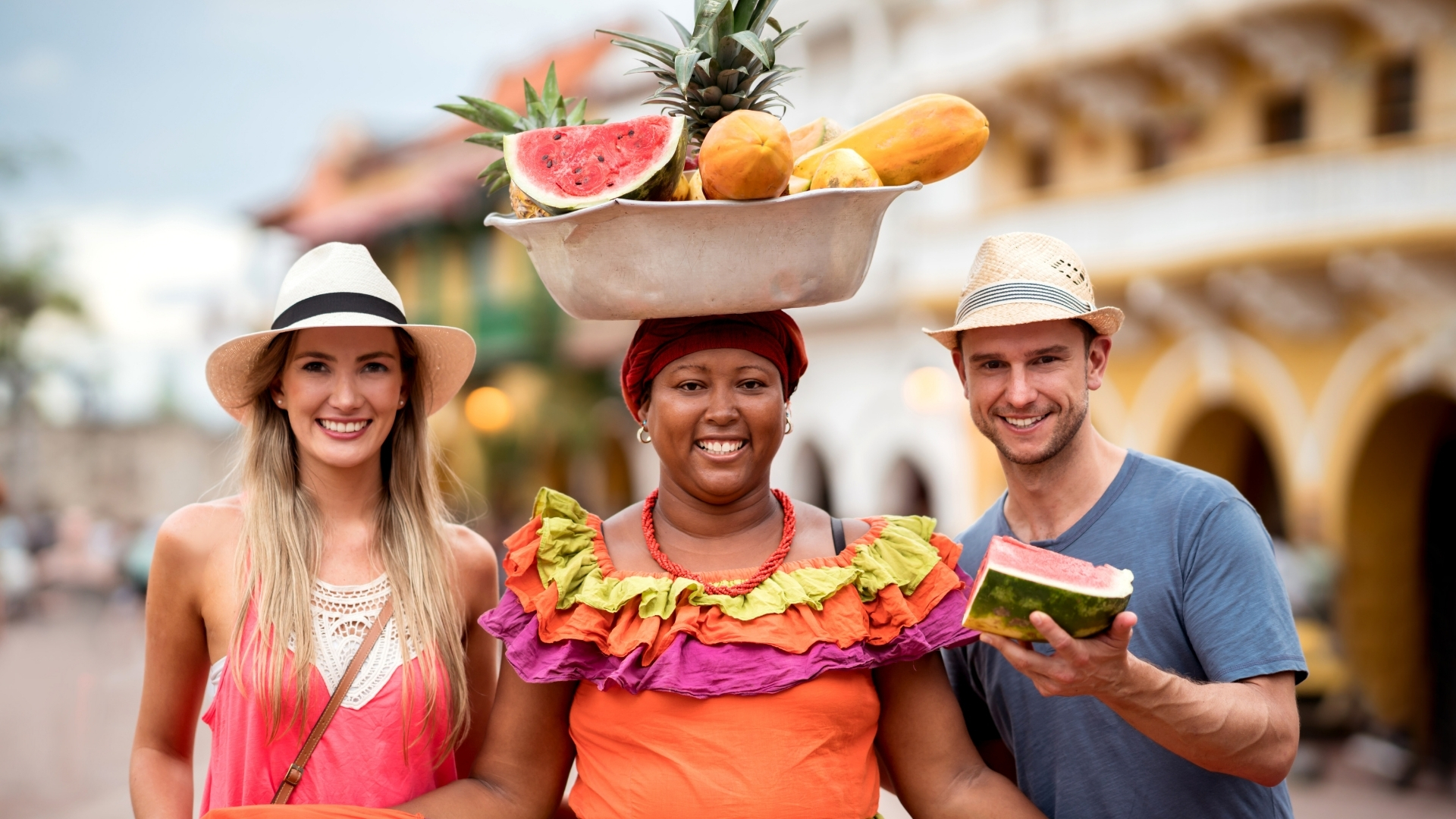 Palenquera posing with travelers in Cartagena
